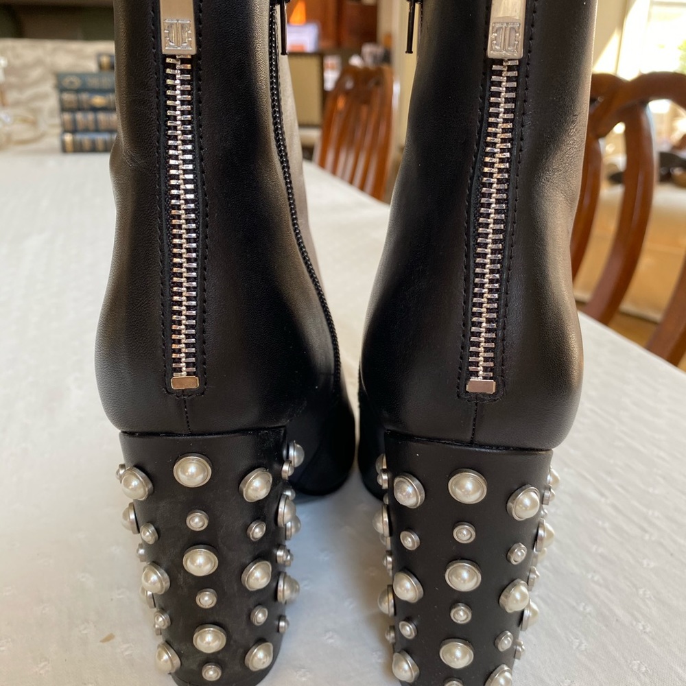 Black booties with pearl embellished heels